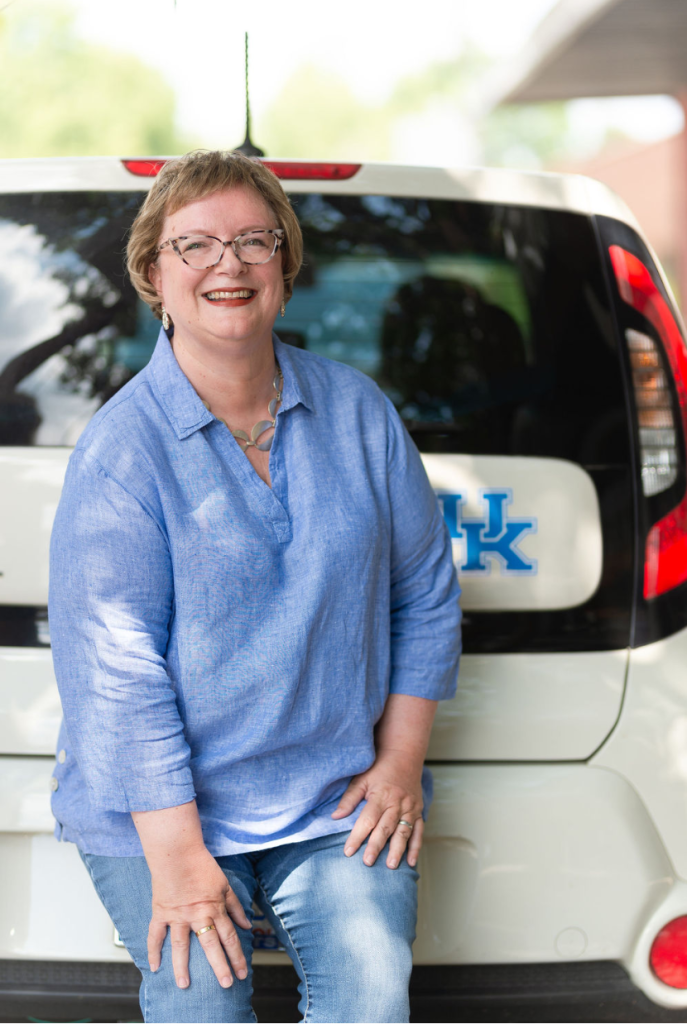 Beth proudly displays her University of Kentucky basketball fandom with a UK sticker on the back of her car.